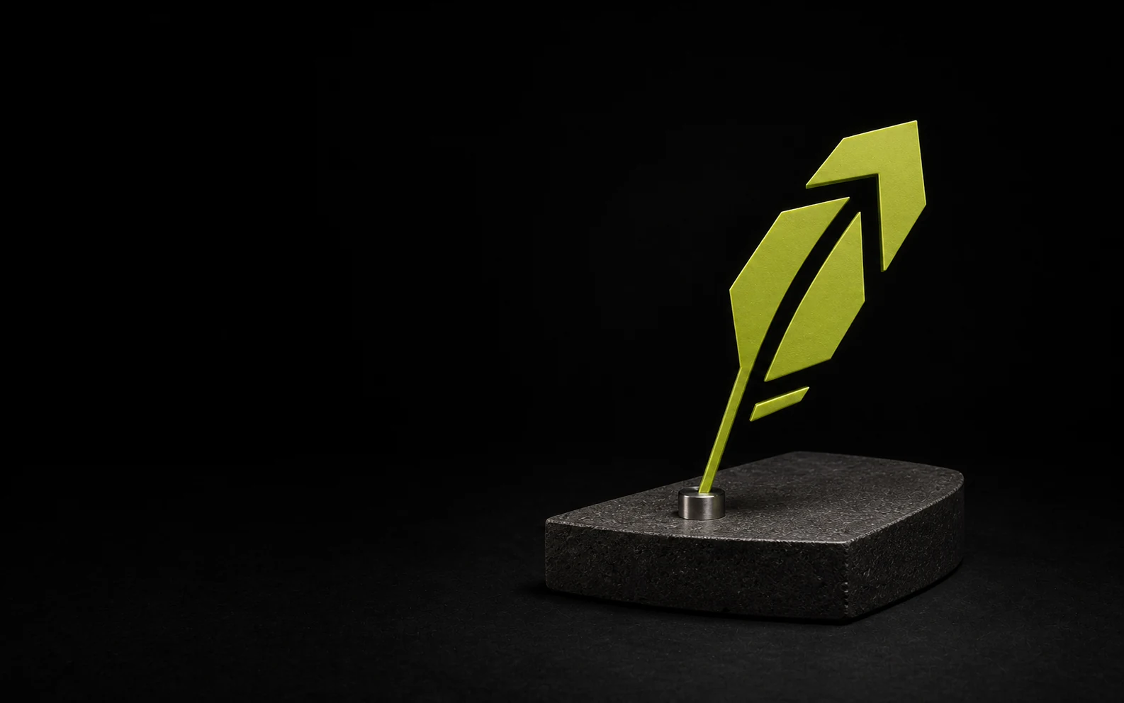 A Free Stock arrow mounted on a black stone plinth